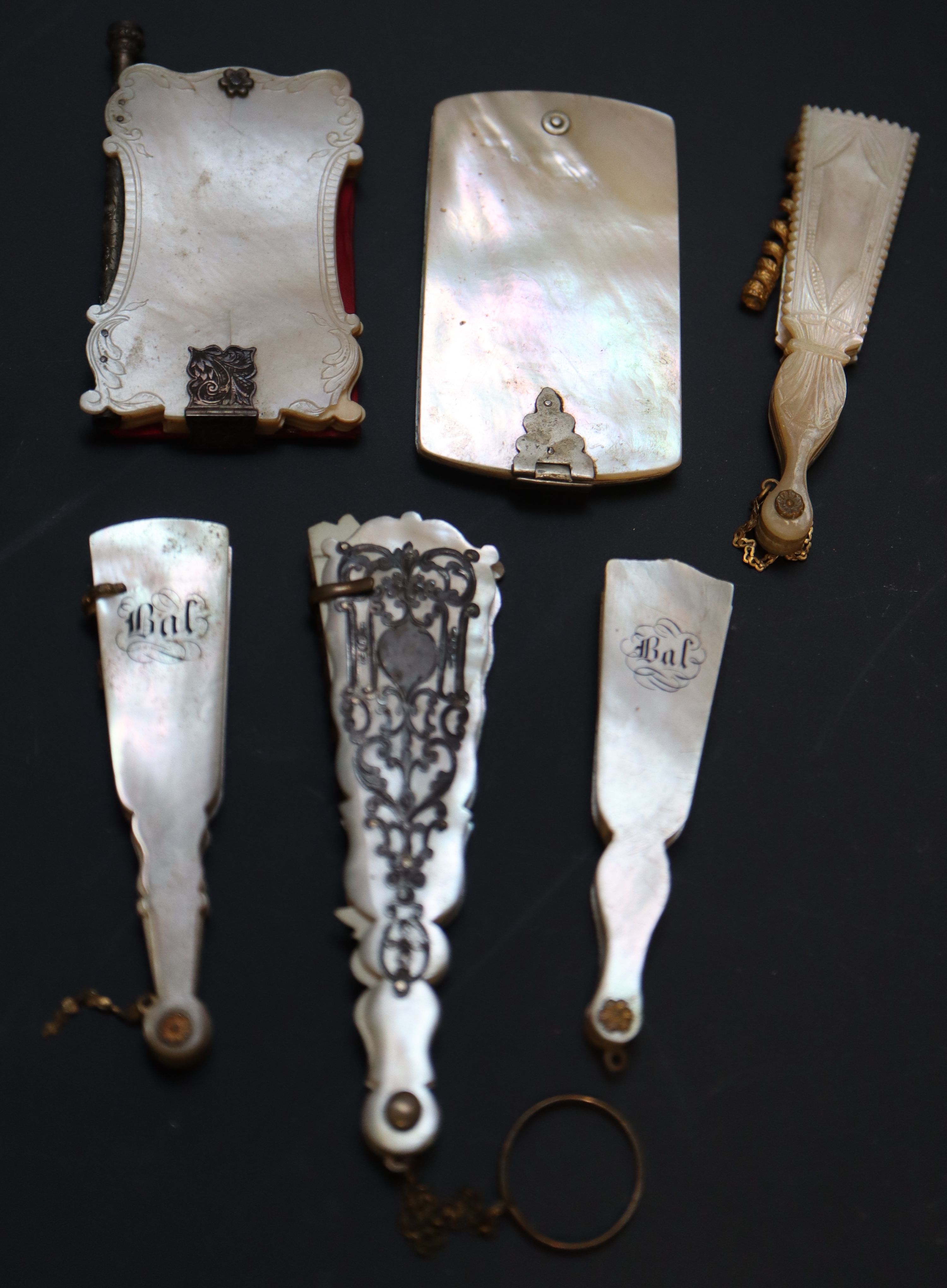 Six 19th century Palais Royale mother of pearl mounted dance cards and note cases largest 9cm